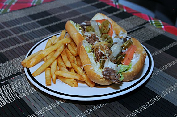 Steak and cheese sub with fries